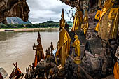 Luang Prabang, Laos - The Pak Ou Caves, the lower cave called Tham Ting. The caves, a Buddhist pilgrimage site, are a repository of old Buddha statues. 